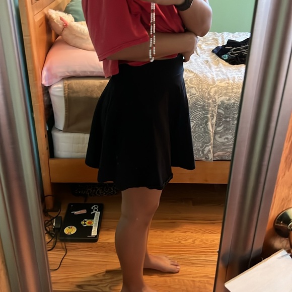 I am selling a simple black skirt that is in fair condition. - Picture 2 of 3